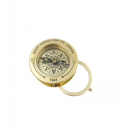 Tourist compass with magnifying glass