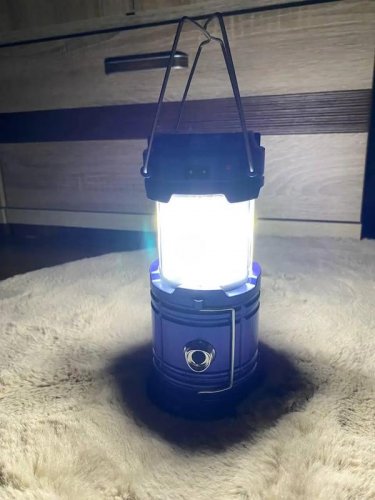 Camping torch with charger and flame effect