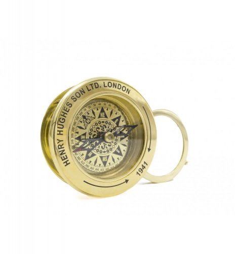 Tourist compass with magnifying glass