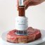 Meat grinder with injector for marinade